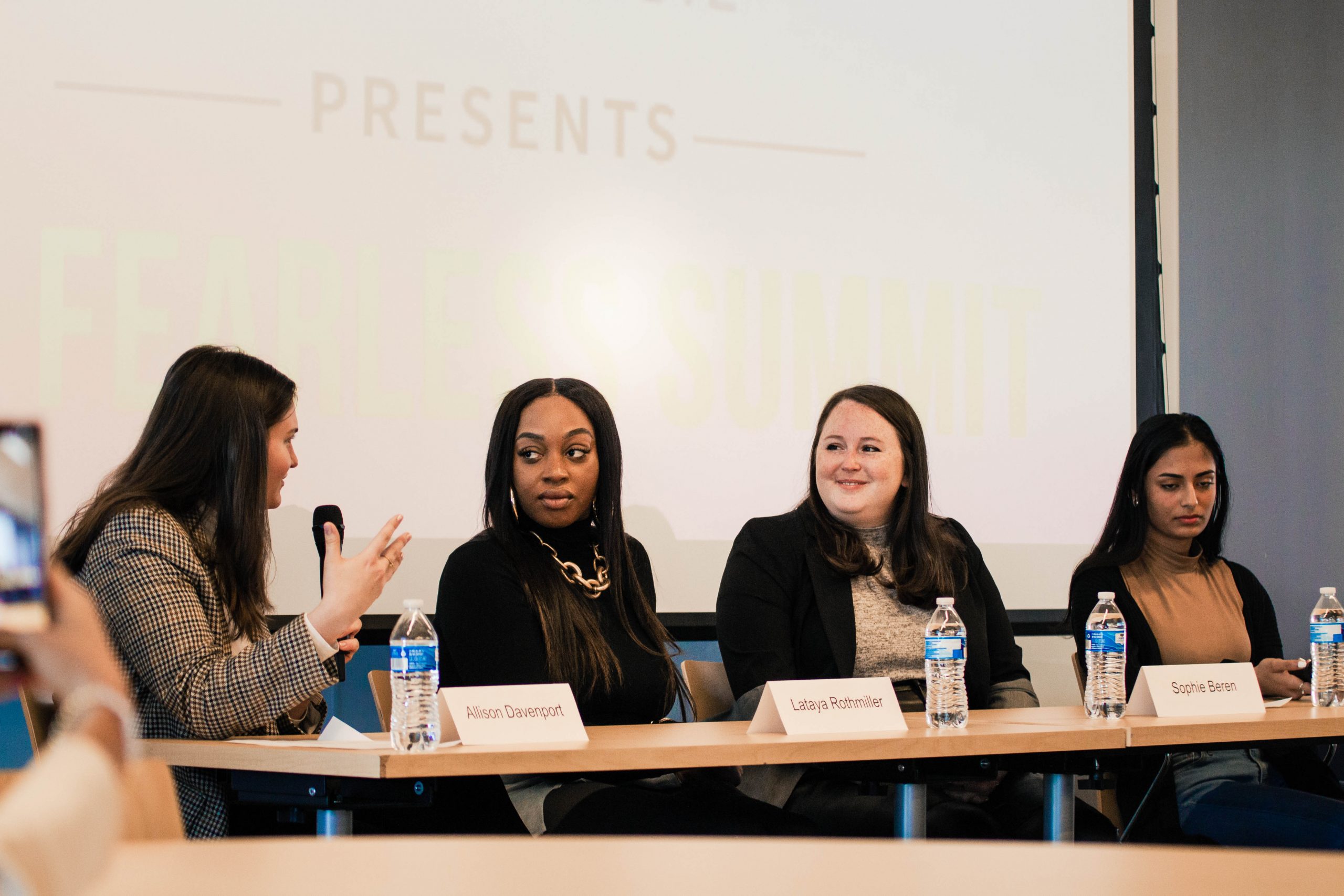 A group of women giving a presentation at a Day of Discovery event.