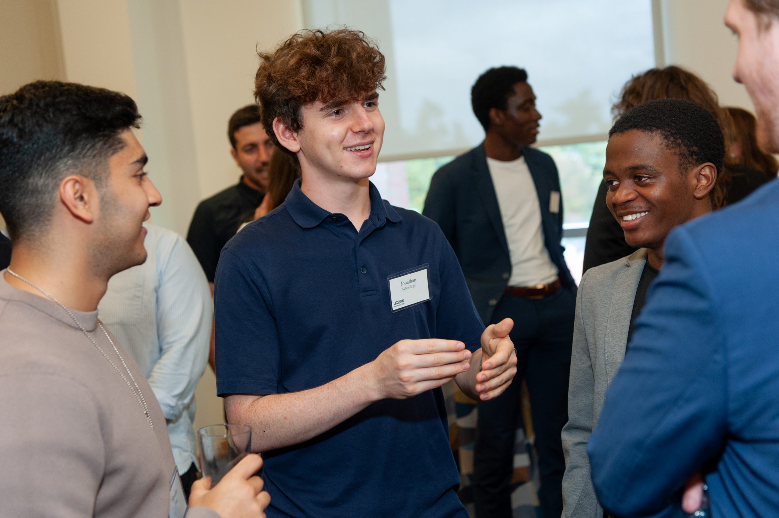 Students network with each other at an event.