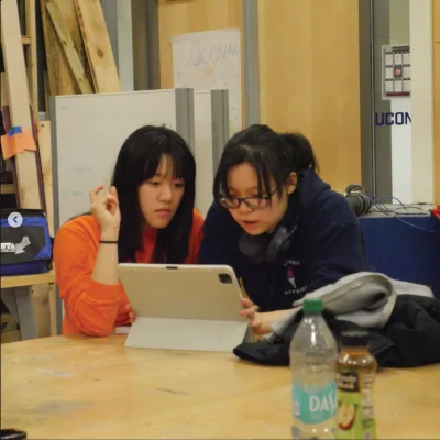 Two students look over an iPad during the University of Connecticut’s annual hackathon competition, HackUConn. The event took place from  Friday, Feb. 27 to Saturday, Feb. 28 in Peter J. Werth Residence Tower. Photo courtesy of @hackuconn on Instagram