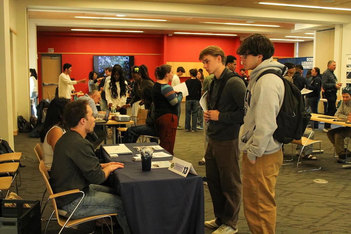 Students networking with exhibitors at the 2025 Research Connections event. (uconnlc Instagram Photo)
